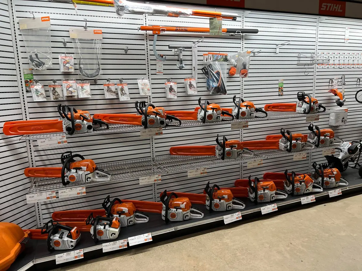 Wall display of STIHL chainsaws and accessories in the showroom